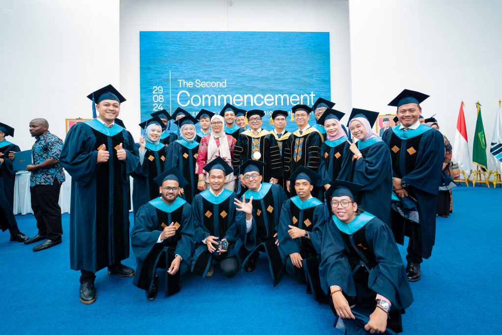 A group photo of the 16 MA graduates from six countries which is Indonesia, Pakistan, India, Afghanistan, Gambia, and Timor-Leste celebrating at Universitas Islam Internasional Indonesia.